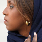 Élégantes boucles Nun Eight Ounce, style minimaliste et raffiné pour un look moderne.